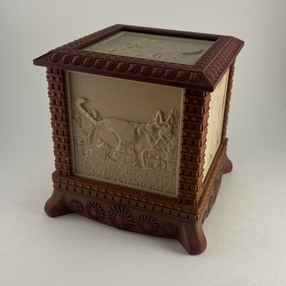 Unlit gothic photo box showing the carved frame, feet and lithophane relief